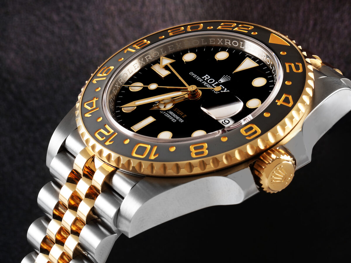 Every Rolex Bezel Type Explained - Rolex GMT Master II Steel and Gold 126713 GRNR